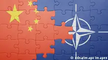 puzzle with the national flag of china and nato . concept