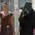 A woman in a burqa walking alongside a Spanish woman