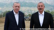 Azerbaijani President Ilham Aliyev, right, and Turkey's President Recep Tayyip Erdogan, pose for photos outside Shusha, in Nagorno-Karabakh, Azerbaijan, Tuesday, June 15, 2021. Shusha, a culturally revered city that Azerbaijan liberated from Armenian forces in last autumn's war. Shusha, a center of Azerbaijani Turkish culture for centuries, came under Armenian control in 1992 in fighting over the separatist Nagorno-Karabakh region.(Turkish Presidency via AP, Pool)