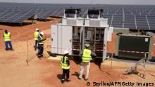 Technicians operate electrical cabinets on October 22, 2016 during the opening ceremony of a new photovoltaic energy production site in Bokhol.
Senegal put into service one of sub-Saharan Africa's largest solar energy projects Saturday as it pushes to become a regional player in renewables on a continent where the majority remain off-grid. / AFP PHOTO / SEYLLOU (Photo credit should read SEYLLOU/AFP via Getty Images)