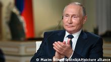 Russian President Vladimir Putin gestures while speaking to NBC News journalist Keir Simmons in an interview aired on Monday, June 14, 2021, two days before the Russian leader is to meet U.S. President Joe Biden in Geneva. Putin has sharply dismissed allegations that his country is carrying out cyberattacks against the United States as baseless. (Maxim Blinov, Sputnik, Kremlin Pool Photo via AP)