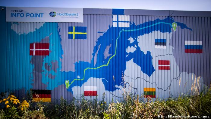 An information center in a container with the map of the Nord Stream 2 route with flags representing which countries it bypasses near the natural gas receiving station of the Nord Stream 2 Baltic Sea pipeline