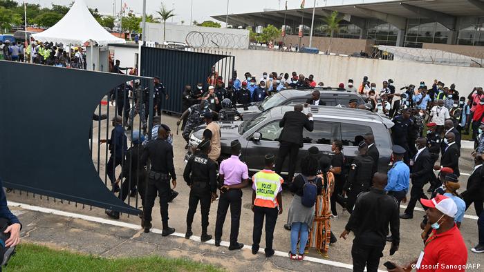 SUVs leave the airport in Abidjan