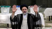 (FILES) In this file photo taken on June 18, 2021 Iranian ultraconservative cleric and presidential candidate Ebrahim Raisi waves after casting his ballot for presidential election, in the capital Tehran. - Congratulations poured in for ultraconservative Ebrahim Raisi today on winning Iran's presidential election as his rivals conceded even before official results were announced. The other three candidates in the race all congratulated him for his victory, which had been widely expected after a host of heavyweight rivals had been barred from running. (Photo by ATTA KENARE / AFP)