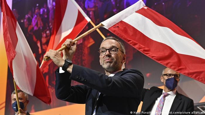 Herbert Kickl waving the Austrian flag