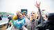Two women make the "rock on" hand symbol at the Download Festival in England Two women make the "rock on" hand symbol at the Download Festival in England