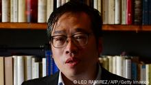 In this picture taken on June 10, 2021, former Tsinghua University lecturer Wu Qiang poses for a photo during an interview at his apartment in Beijing. - In a small, book-strewn apartment in Beijing's outskirts lives one of the last Chinese academics who refuses to be silenced by the ruling Communist Party's relentless crackdown on intellectuals. - TO GO WITH China-politics-rights,PROFILE by Laurie CHEN (Photo by LEO RAMIREZ / AFP) / TO GO WITH China-politics-rights,PROFILE by Laurie CHEN (Photo by LEO RAMIREZ/AFP via Getty Images)