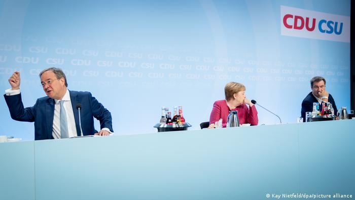 Armin Laschet, Angela Merkel i Markus Soeder