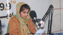 An Afghan female journalist hosts a radio program at the radio-television channel Ghazal in Shiberghan city, in April 2021