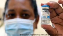 (210515) -- HAVANA, May 15, 2021 (Xinhua) -- A medical worker displays a vial of Abdala, a homemade COVID-19 vaccine, at a vaccination site in Havana, Cuba, on May 14, 2021. Cuba on Wednesday began a mass vaccination campaign against COVID-19 in the country's capital of Havana as part of an intervention study of homemade vaccine candidates. At present, phase 3 clinical trials for Cuban COVID-19 vaccine candidates Soberana-02 and Abdala are underway, so are intervention studies involving frontline workers from across the country. (Photo by Joaquin Hernandez/Xinhua)