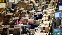 Amazon fulfillment centre. Staff label and package items in the on-site dispatch hall inside one of Britain's largest Amazon warehouses in Dunfermline, Fife, as the online shopping giant gears up for the Christmas rush and the forthcoming Black Friday sales. Picture date: Monday November 13, 2017. The site is believed to be the size of 14 football pitches and the UK's largest distribution centre. Photo credit should read: Jane Barlow/PA Wire URN:33744033
