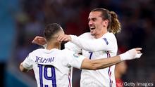 BUDAPEST, HUNGARY - JUNE 23: Karim Benzema of France celebrates with teammate Antoine Griezmann after scoring their side's second goal during the UEFA Euro 2020 Championship Group F match between Portugal and France at Puskas Arena on June 23, 2021 in Budapest, Hungary. (Photo by Alex Pantling/Getty Images)