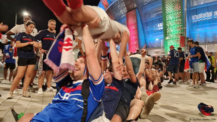 French fans celebrate group victory after 2-2 against Portugal