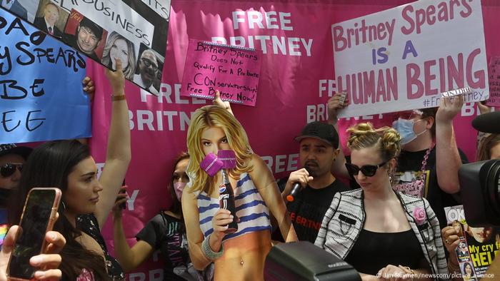 Fans and supporters of Britney Spears holding up signs