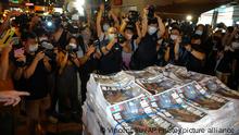 Last issue of Apple Daily arrive at a newspaper booth in Hong Kong, early Thursday, June 24, 2021. Hong Kong's pro-democracy Apple Daily newspaper will stop publishing Thursday, following last week's arrest of five editors and executives and the freezing of $2.3 million in assets under the city's year-old national security law. (AP Photo/Vincent Yu)