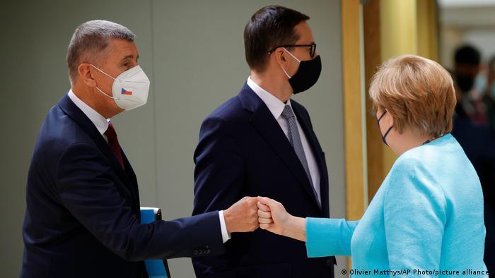 Czech Republic's Prime Minister Andrej Babis, left, greets Germany's Chancellor Angela Merkel during an EU summit