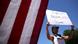In Washington DC, a protester holds aloft a 'Boycott Beijing 2022 Olympics' sign In Washington DC, a protester holds aloft a 'Boycott Beijing 2022 Olympics' sign