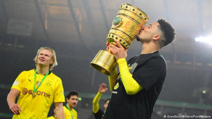 Jadon Sancho celebrates with the trophy after Borussia Dortmund's German Cup triumph