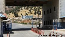 A road sign that reads Welcome to Bab al-Hawa crossing is seen at Bab al-Hawa crossing at the Syrian-Turkish border, in Idlib governorate, Syria June 10, 2021. Picture taken June 10, 2021. REUTERS/Khalil Ashawi