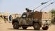 german army Bundeswehr, patrol with Eagle Mowag armored vehicle in village german army Bundeswehr, patrol with Eagle Mowag armored vehicle in village