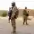 Des soldats de la Bundeswehr sécurisent l'aéroport du camp Castor à Gao, dans le nord du Mali