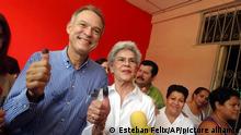 Former Nicaraguan President Violeta Barrios de Chamorro, center, poses for a photo acompained by her son Pedro Joaquin Chamorro Barrios, mayoral candidate of Liberal Constitucionalist Party after casting their votes in Managua, Nicaragua, Sunday, Nov. 7, 2004. Some 3.3 million Nicaraguans will elect their mayors throughout the country.( AP Photo/Esteban Felix)