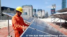 A worker of EVN Hanoi installs panels for solar electricity production for poor households in the capital city’s suburban Quoc Oai District. According to McKinsey & Company, renewables are potentially the lowest-cost option for Vietnam to meet its energy needs.
