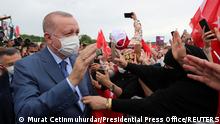 Turkish President Tayyip Erdogan greets his supporters as he arrives at the groundbreaking ceremony of Sazlidere Bridge over the planned route of Kanal Istanbul, in Istanbul, Turkey June 26, 2021. Murat Cetinmuhurdar/Presidential Press Office/Handout via REUTERS ATTENTION EDITORS - THIS PICTURE WAS PROVIDED BY A THIRD PARTY. NO RESALES. NO ARCHIVE.