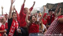 Soccer Football - Euro 2020 - Fans gather in fan zone for Wales v Denmark - Copenhagen, Denmark - June 26, 2021 Denmark fans celebrate REUTERS/Hannah Mckay