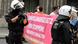 Police respond to a demonstration in Dusseldorf, as protesters hold a red banner Police respond to a demonstration in Dusseldorf, as protesters hold a red banner