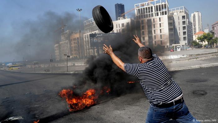 Demonstrators burn tires to block the Martyrs' Square in the centre of Lebanon's capital Beirut 