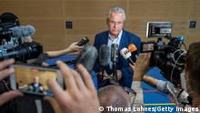 WURZBURG, GERMANY - JUNE 26: Bavarian Interior Minister Joachim Hermann speaks to the media after a fatal attack by a knife-wielding man on June 26, 2021 in Wurzburg, Germany. Abdirahman J. A., 24, who arrived in Germany from Somalia in 2015, yesterday stabbed three people fatally apparently at random and injured approximately a dozen more, five of them seriously, before being shot in the leg by a policeman and arrested. Police say they so far do not have a motive for the crime but that Abdirahman J. A. has a criminal history. (Photo by Thomas Lohnes/Getty Images)