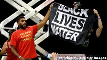 HENDERSON, NEVADA - SEPTEMBER 13: Protesters hold up a Black Lives Matter banner during a campaign event by U.S. President Donald Trump at Xtreme Manufacturing on September 13, 2020 in Henderson, Nevada. Trump's visit comes after Nevada Republicans blamed Democratic Nevada Gov. Steve Sisolak for blocking other events he had planned in the state. (Photo by Ethan Miller/Getty Images)