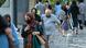 People in Tehran wearing facemasks in street People in Tehran wearing facemasks in street