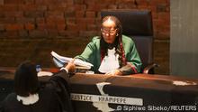 Judge Sisi Khampepe hands over documents after giving a ruling on whether former South African President Jacob Zuma should be punished for defying summons at an inquiry into corruption during his time in power, at the Constitutional Court in Johannesburg, South Africa, June 29, 2021. REUTERS/Siphiwe Sibeko