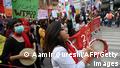 Activists of 'Aurat March' shout slogans and carry placards during a rally to mark International Women's Day in Islamabad in 2021
