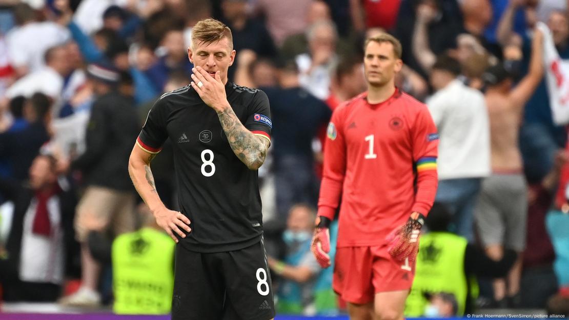 Toni Kroos covers his mouth with his hand