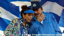 FILE - In this Sept. 5, 2018 file photo, Nicaragua's President Daniel Ortega and his wife and Vice President Rosario Murillo, lead a rally in Managua, Nicaragua. Ortega said Thursday, Feb. 21, 2019, that he will restart talks with his opponents, more than six months after breaking off the last dialogue and unleashing a round of arrests. (AP Photo/Alfredo Zuniga, File)