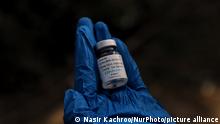 A health worker holds a Vial of COVAXIN Coronavirus Vaccine at a Vaccination Center in Sopore, District Baramulla, Jammu and Kashmir, India on 28 June 2021. (Photo by Nasir Kachroo/NurPhoto)