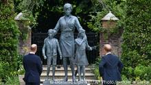 Britain's Prince William, left and Prince Harry unveil a statue they commissioned of their mother Princess Diana, on what woud have been her 60th birthday, in the Sunken Garden at Kensington Palace, London, Thursday July 1, 2021. (Dominic Lipinski /Pool Photo via AP)