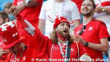 Switzerland fans cheer prior to the Euro 2020 soccer championship quarterfinal match between Switzerland and Spain, at the Saint Petersburg stadium in Saint Petersburg, Friday, July 2, 2021. (Maxim Shemetov /Pool Photo via AP)