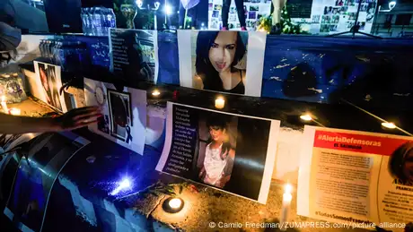 During a vigil in San Salvador, El Salvador, portraits of disappeared women are placed for commemoration