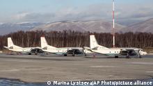 The Antonov An-26 with the same board number #RA-26085 as the missed plane is parked between two other Antonov An-26 planes at Airport Elizovo outside Petropavlovsk-Kamchatsky, Russia, Tuesday, Nov. 17, 2020.Local officials say a plane with 28 people on board has gone missing in the Russian Far East region of Kamchatka. Emergency officials say the Antonov An-26 plane with 22 passengers and six crew members missed a scheduled communication while it was flying Tuesday from the city of Petropavlovsk-Kamchatsky to the village of Palana. (AP Photo/Marina Lystseva)