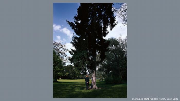 Merkel's lookalike poses by the spruce