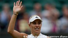Germany's Angelique Kerber celebrates after defeating Czech Republic's Karolina Muchova during the women's singles quarterfinals match on day eight of the Wimbledon Tennis Championships in London, Tuesday, July 6, 2021.(AP Photo/Alastair Grant)