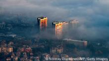 A picture taken from Vitosha mountain on November 27, 2020, shows buildings above clouds in an area with a high level of air pollution in Sofia, Bulgaria. - Winter smog season has settled in and Bulgaria's soaring coronavirus death rate, one of Europe's highest, is prompting experts to warn about a compound health risk from air pollution and Covid-19. (Photo by NIKOLAY DOYCHINOV / AFP) (Photo by NIKOLAY DOYCHINOV/AFP via Getty Images)
