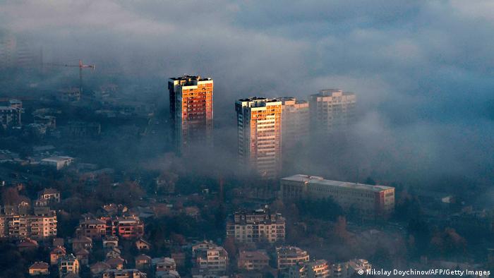 Smog seen rising above residential building in Sofia, Bulgaria
