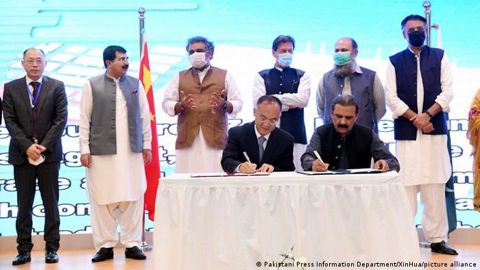 Pakistani Prime Minister Imran Khan (C, Rear) witnesses a signing ceremony of a Memorandum of Understanding between China and Pakistan in Gwadar, Pakistan, on July 5, 2021.