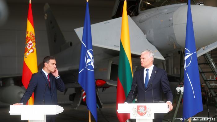 Spanish Prime Minister Pedro Sanchez and Lithuanian President Gitanas Nauseda attend a news conference that was briefly disrupted by an urgent take off at Siauliai air base