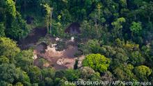 This aerial view shows an illegal gold mine along of Timbiqui River on August 9, 2016 in rural area of Timbiqui, departament of Cauca, Colombia. - In a joint operation of the Colombian Armed Forces, two people were captured and 26 excavators and two dredges were destroyed, according to the authorities belonging to the ELN and other organized armed groups. They have calculated that about 18 kilos of gold were extracted daily, with one kilo of this gold worth approximately 38 thousand dollars. (Photo by Luis ROBAYO / AFP) (Photo by LUIS ROBAYO/AFP via Getty Images)